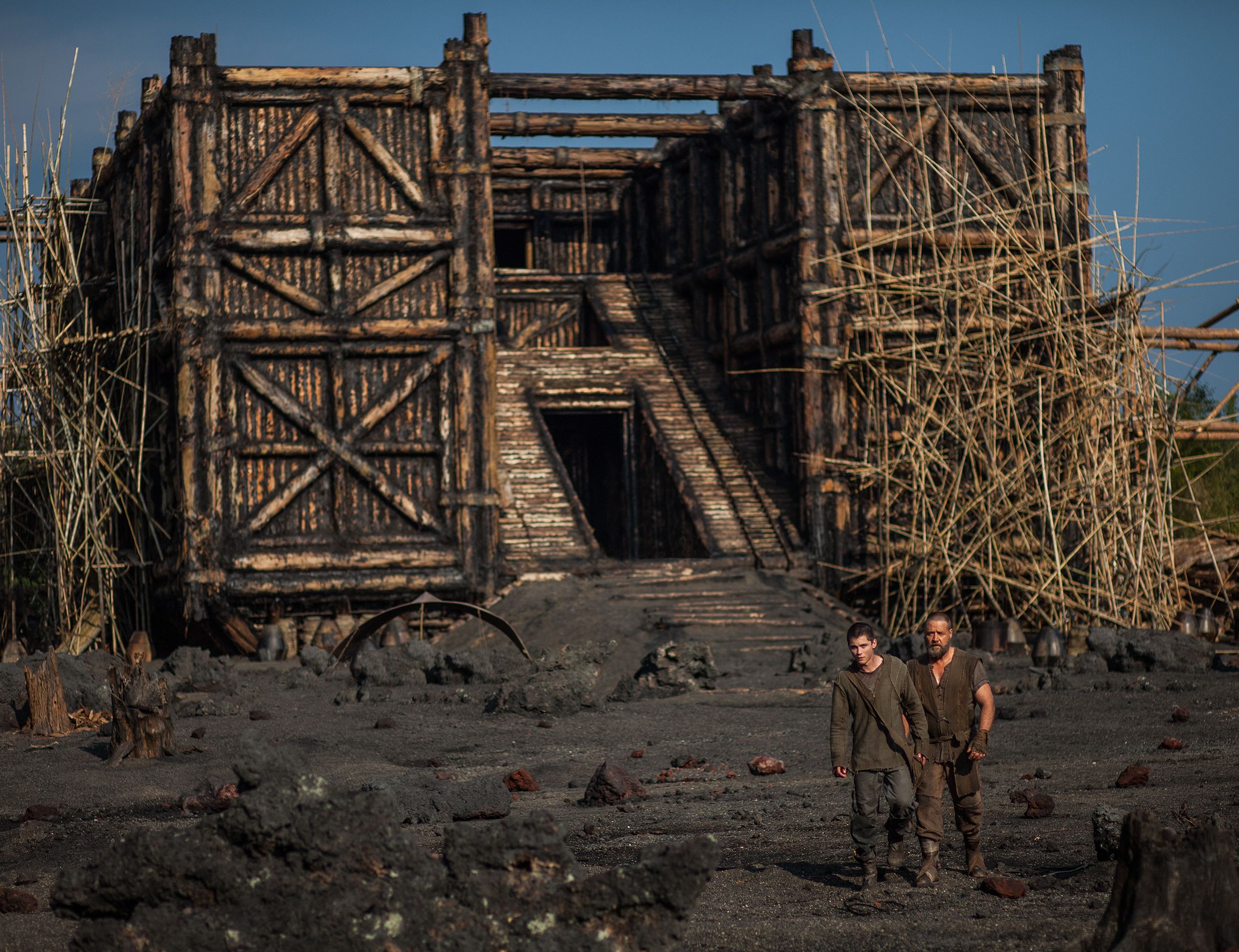 Russell Crowe as Noah in front of his wooden ark