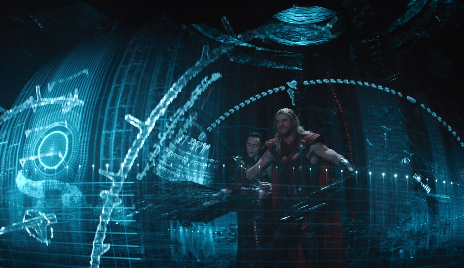 Thor and Loki fly around in futuristic blue ship thingy