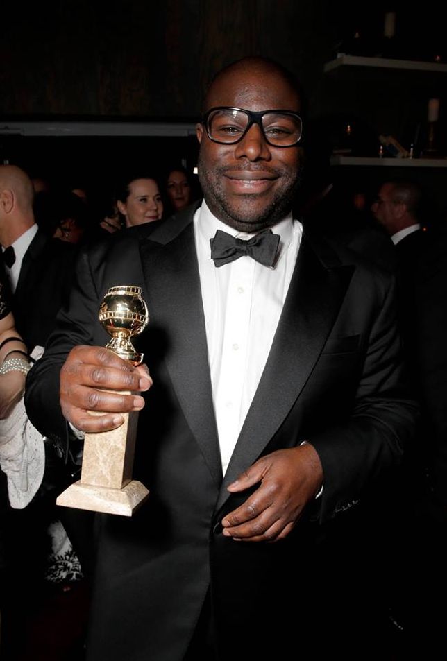 Director Steve McQueen proudly shows off his Golden Globe