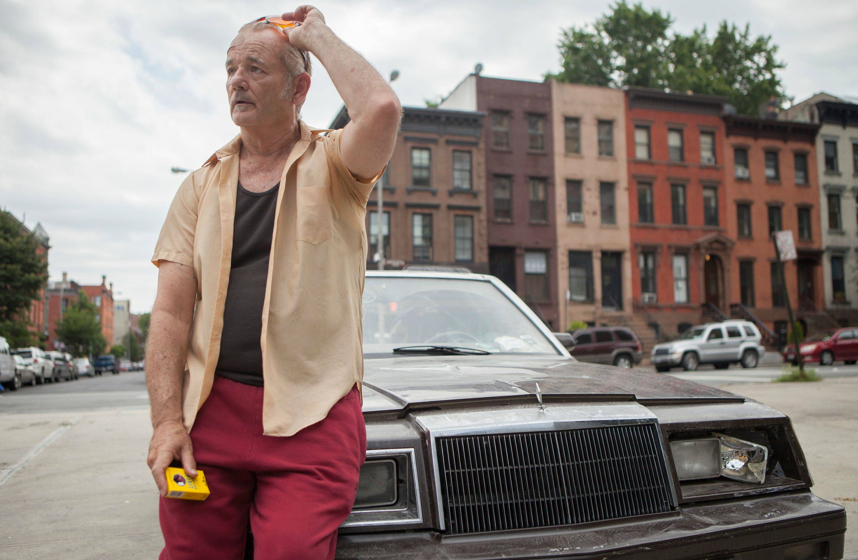 Bill Murray resting on his old ass broken car - St. Vincent