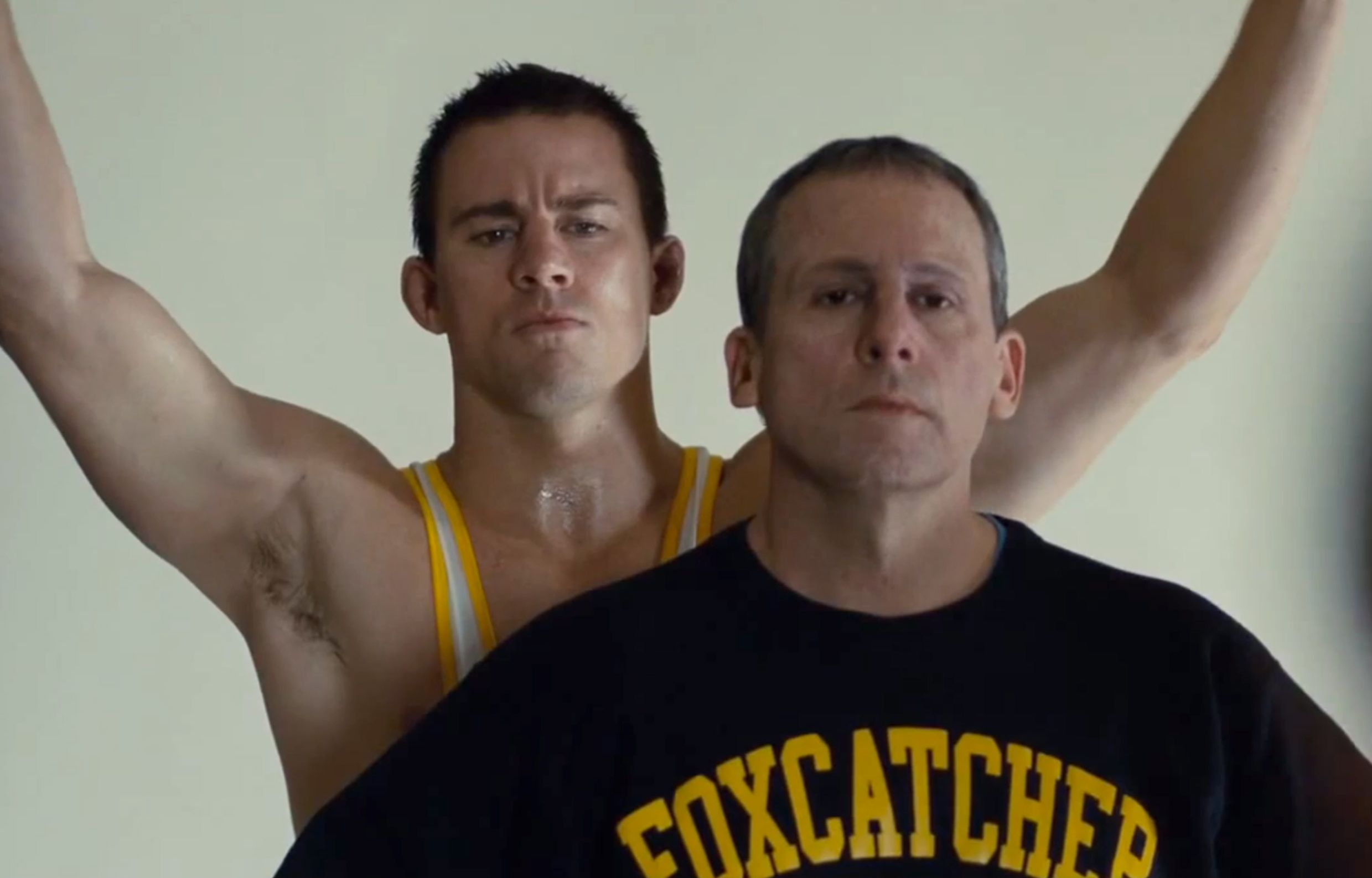 Channing Tatum behing unimpressed Steve Carell