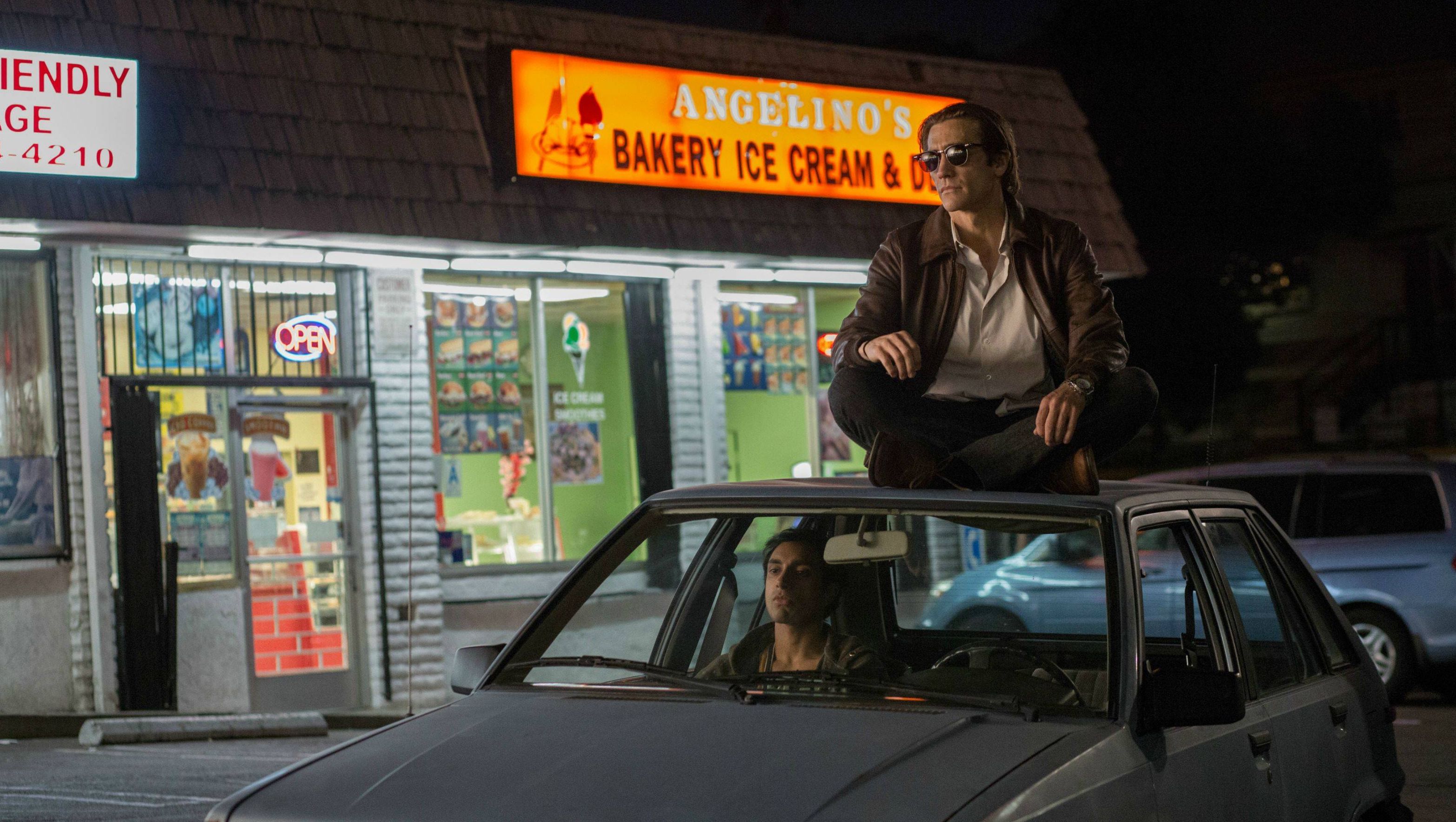 Jake Gyllenhaal on the roof of a car - Nightcrawler