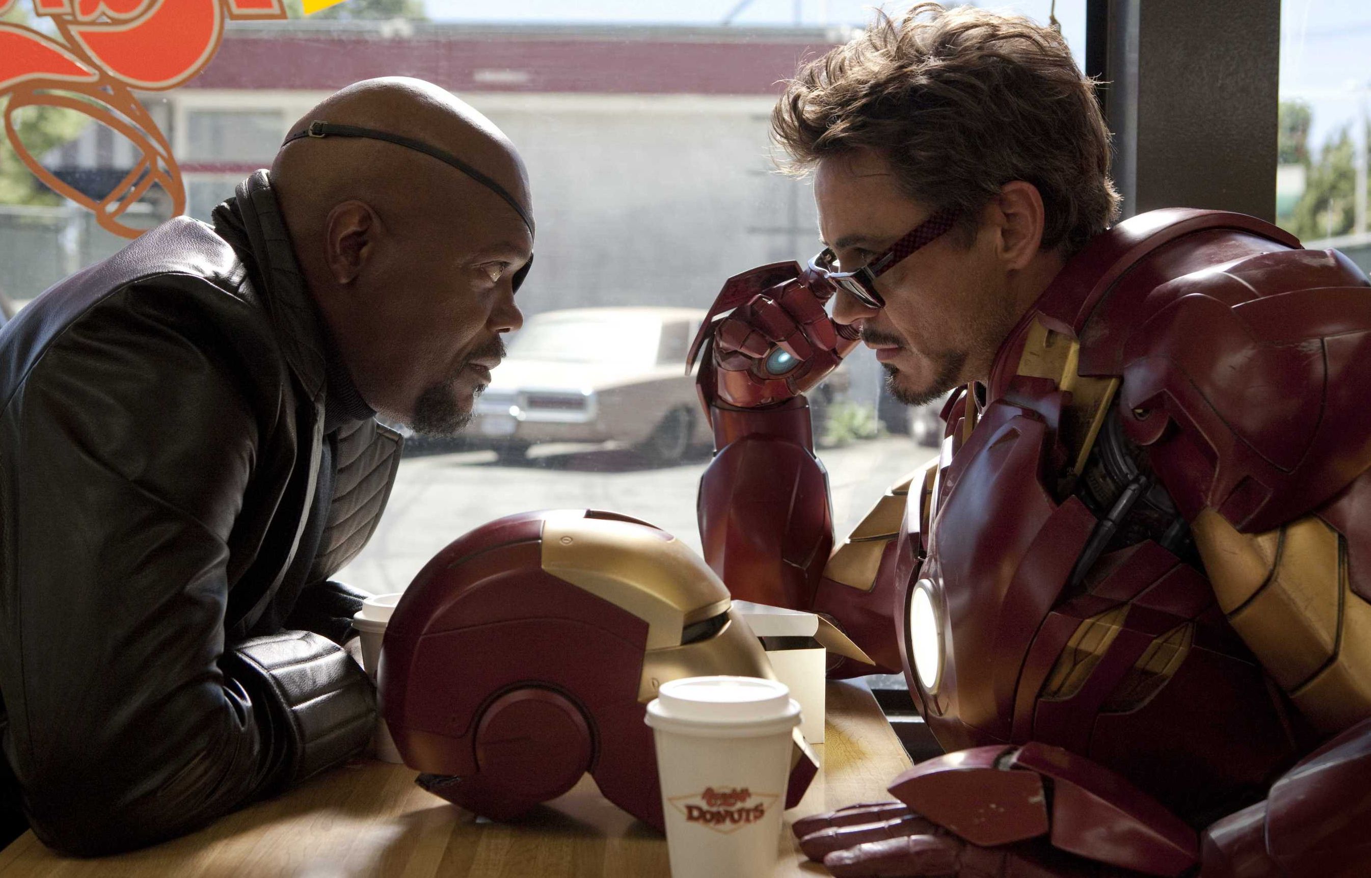 Nick Fury and Iron Man have a little chat over some coffee