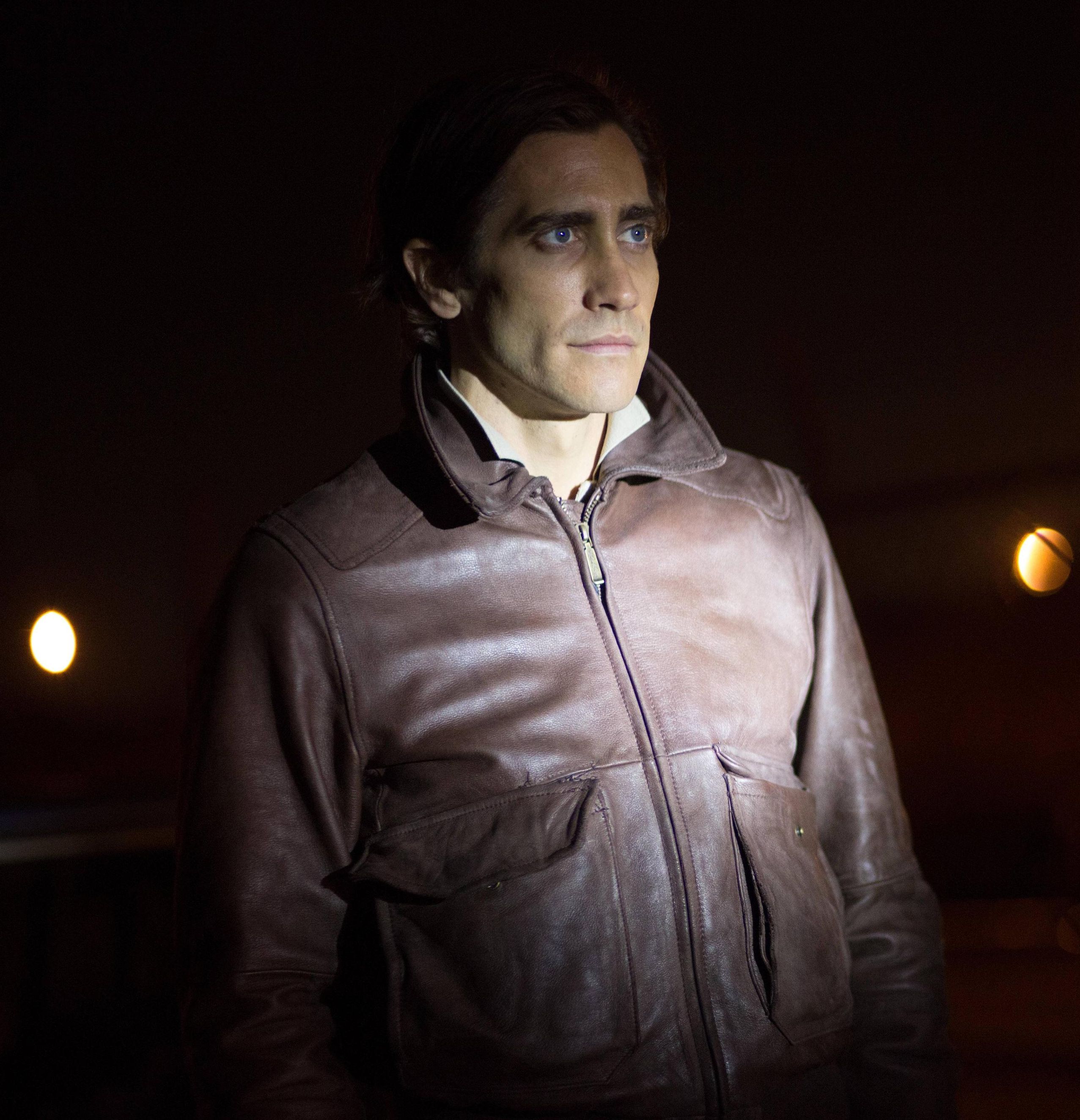 Jake Gyllenhaal as the Nightcrawler in brown leather jacket