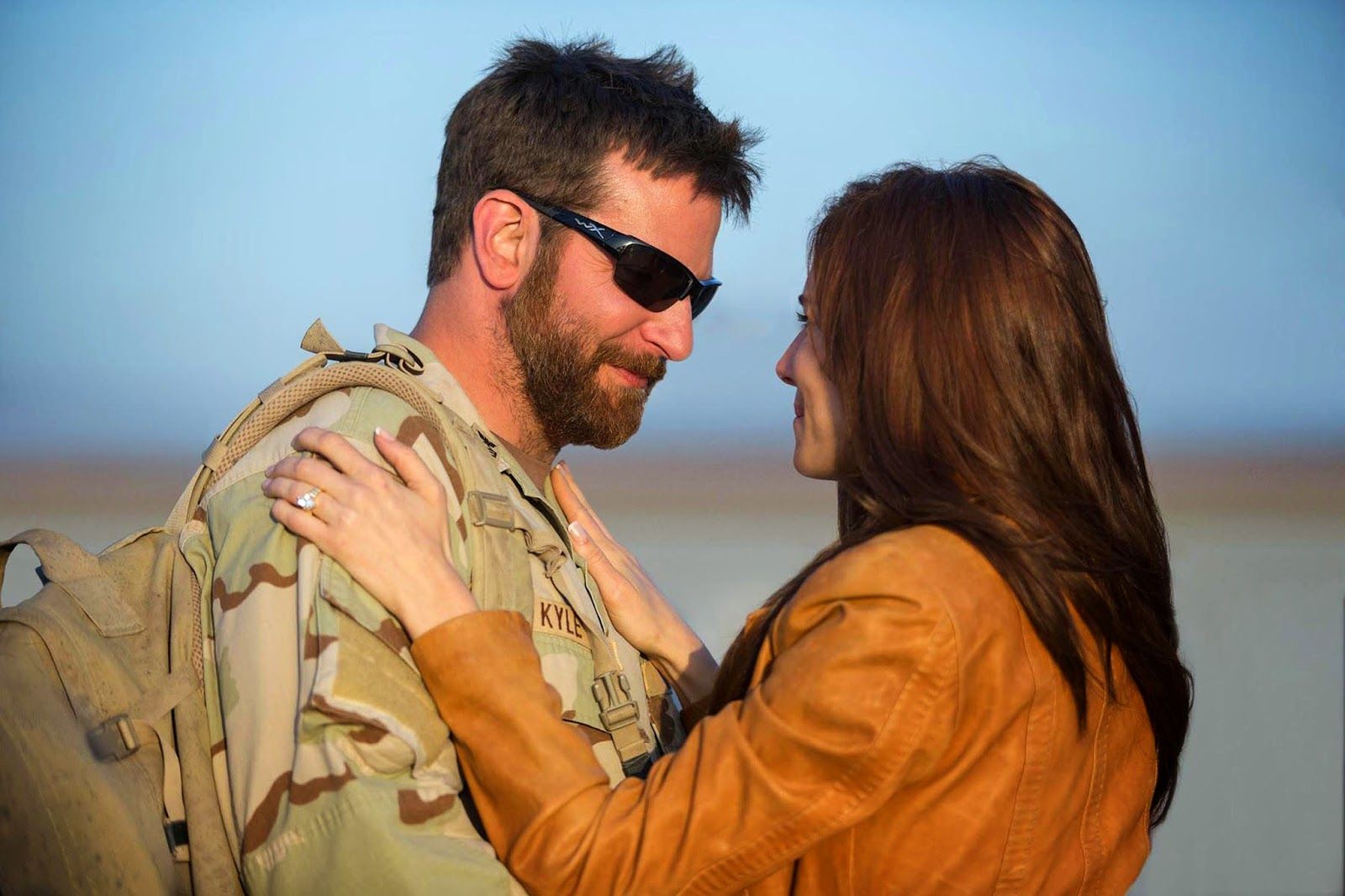 Bradley Cooper as Chris Kyle and Sienna Miller as Taya Renae