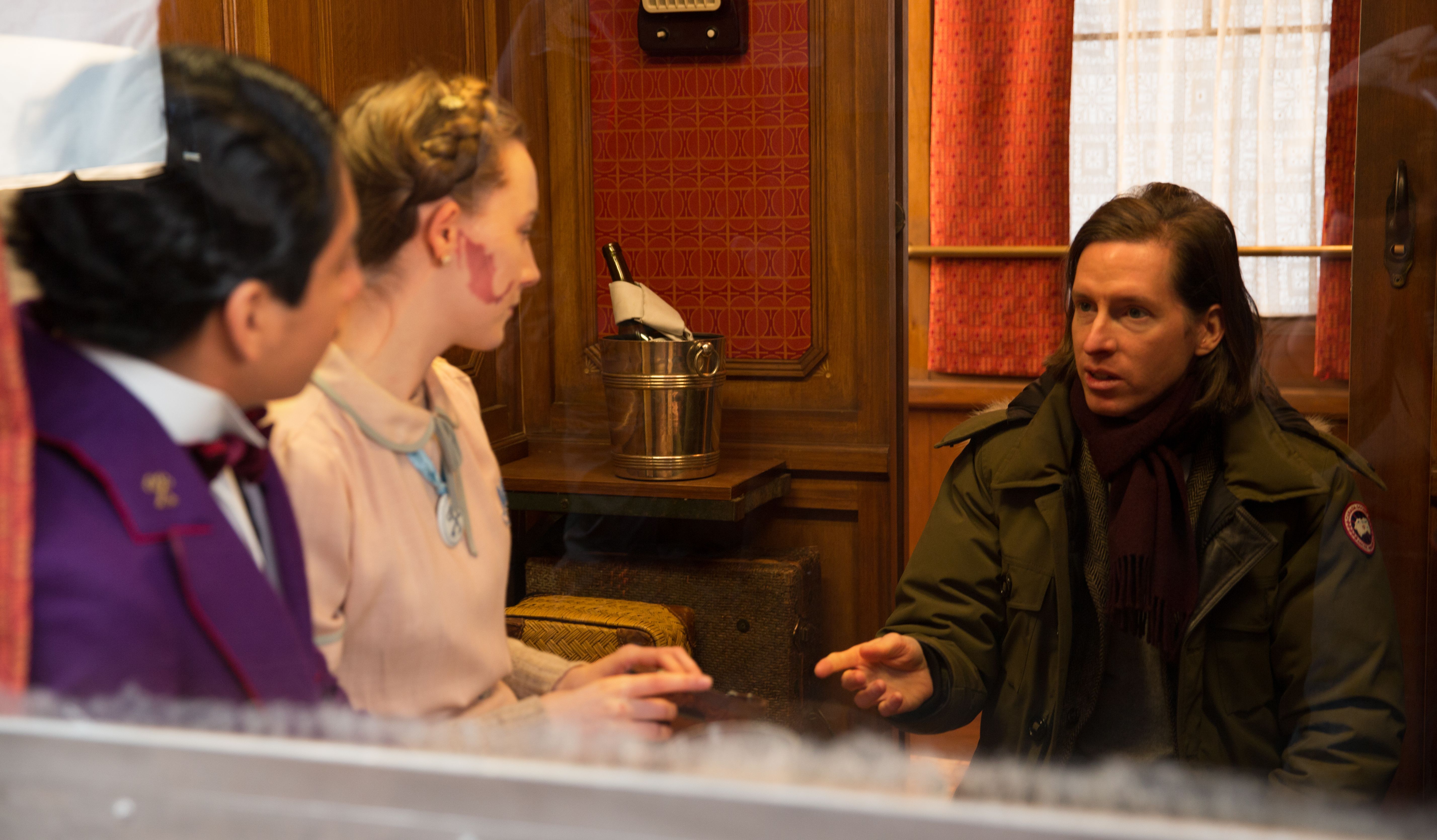 Wes Anderson on set with Saoirse Ronan and Tony Revolori