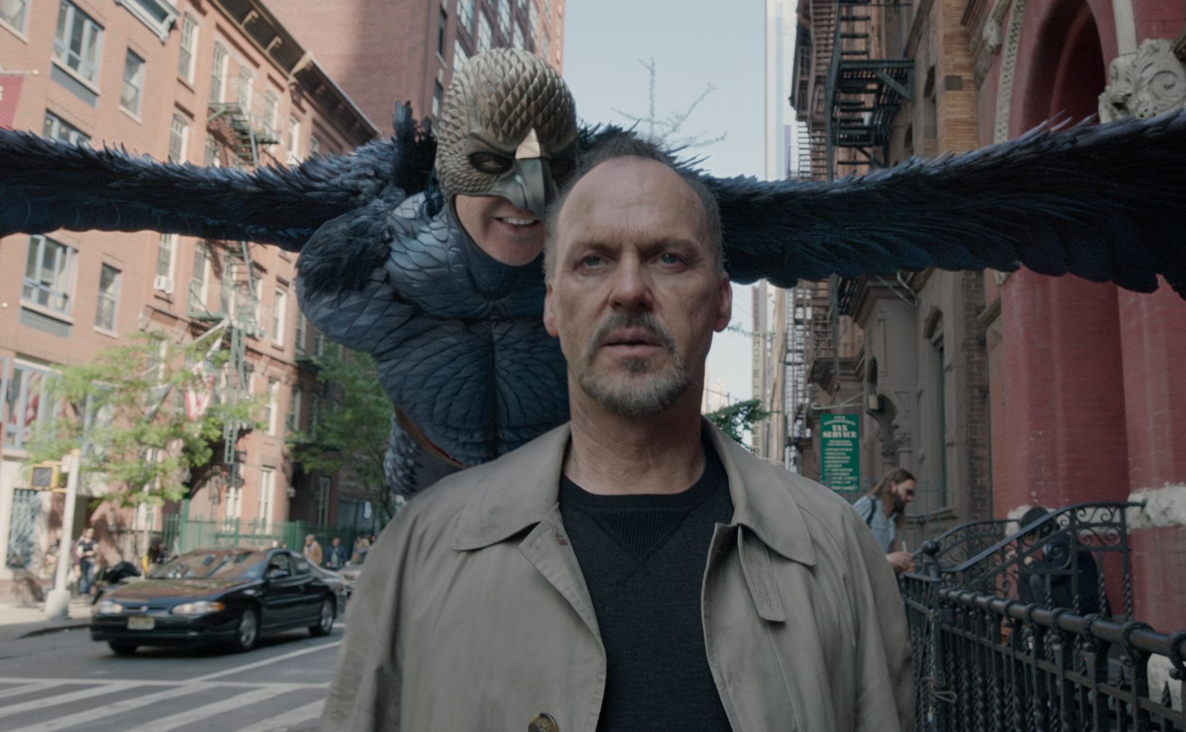 Bird flying behind Michael Keaton in Birdman
