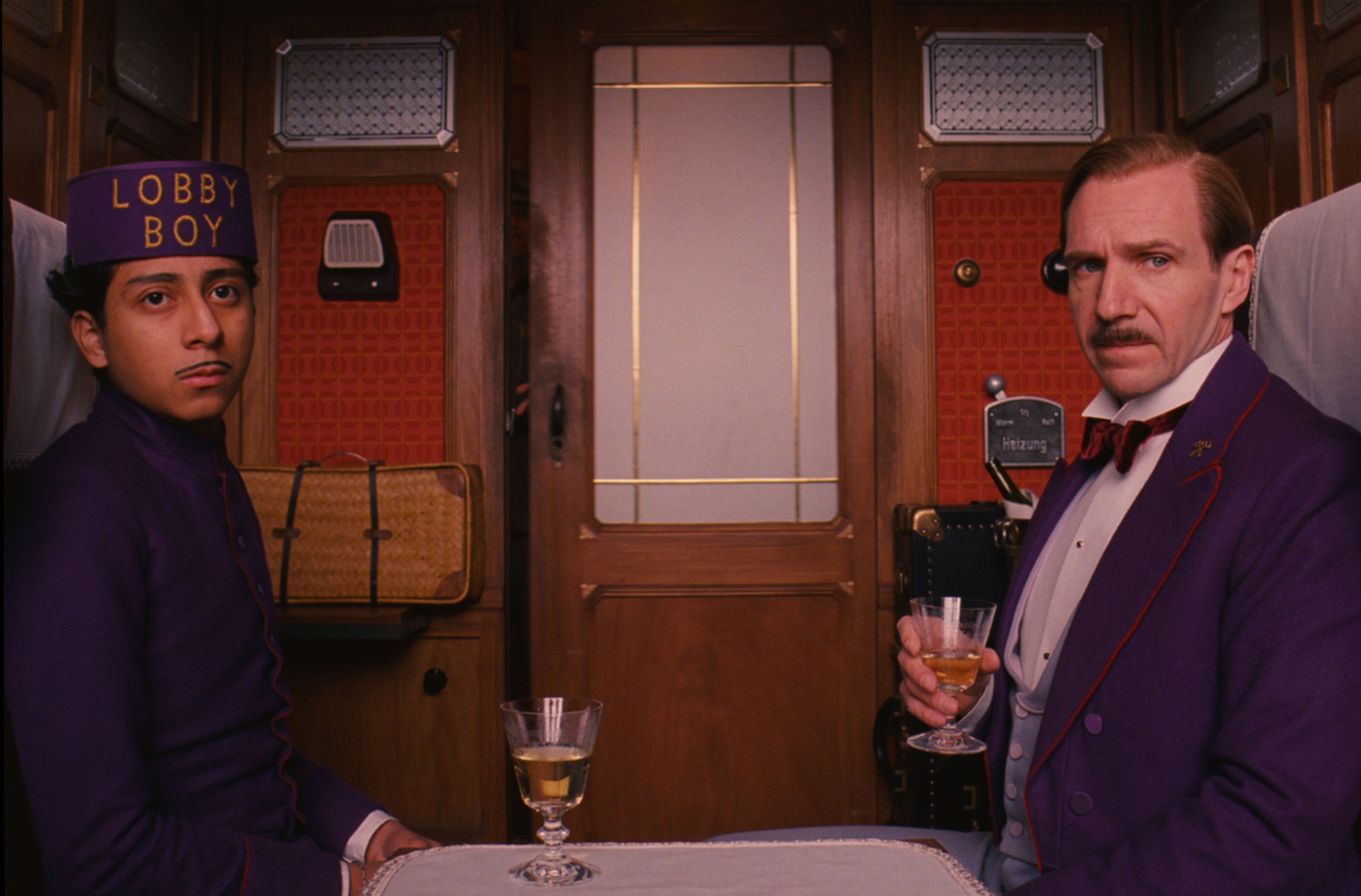 Lobby Boy and Gustave on train in Wes Anderson&#039;s The Grand B