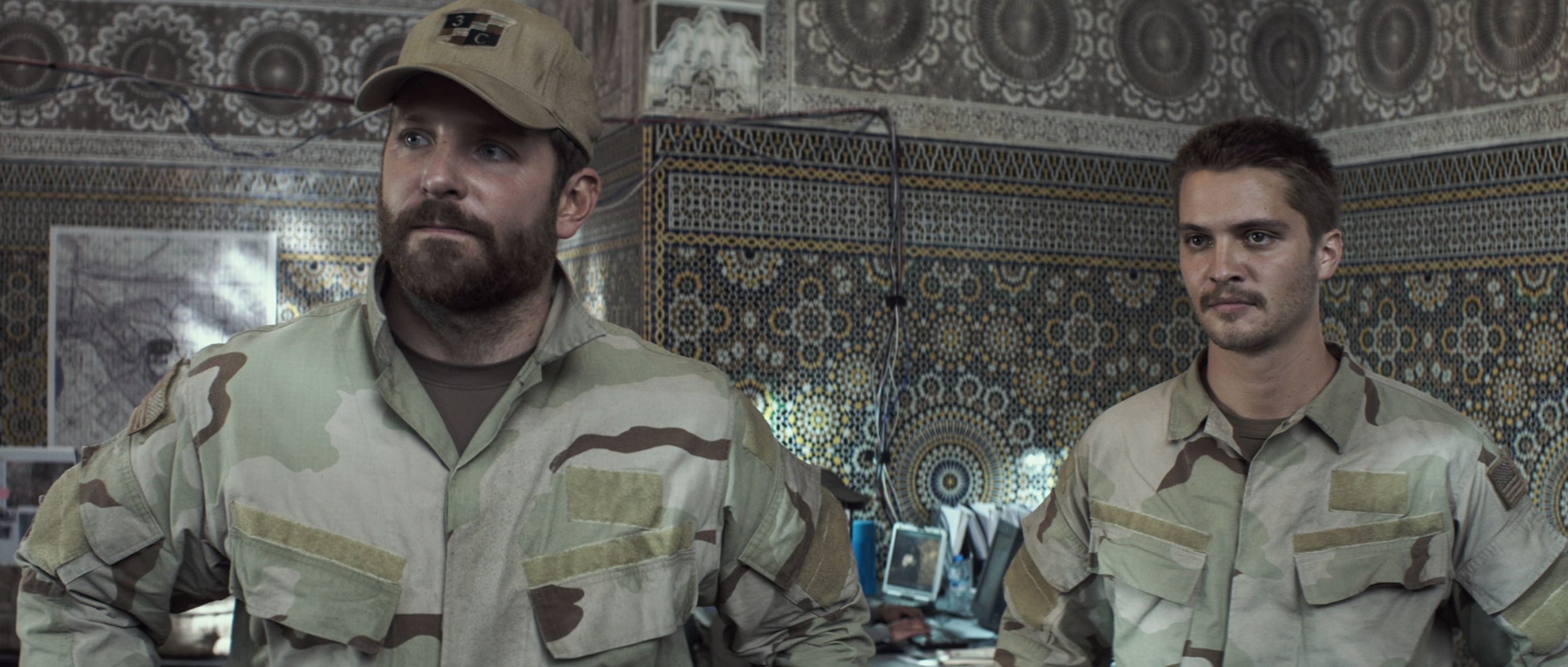 Brian Hallisay and Bradley Cooper in American Sniper