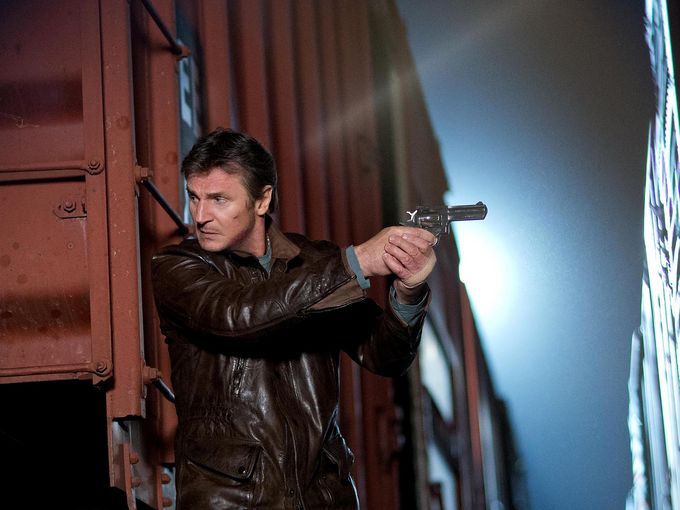Liam Neeson armed