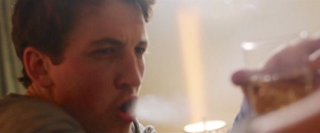 Miles Teller blows smoke