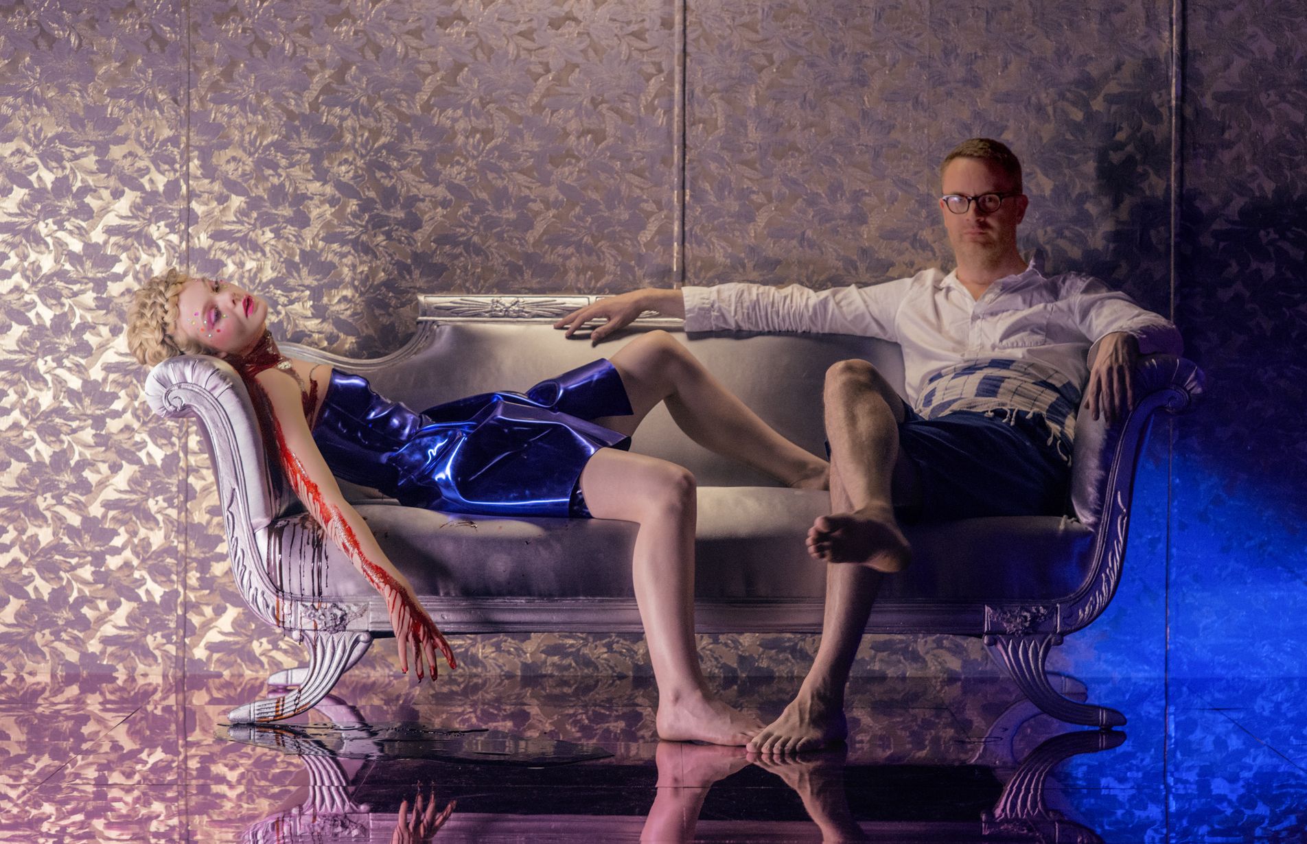 Fanning drips blood, Refn sits calmly beside