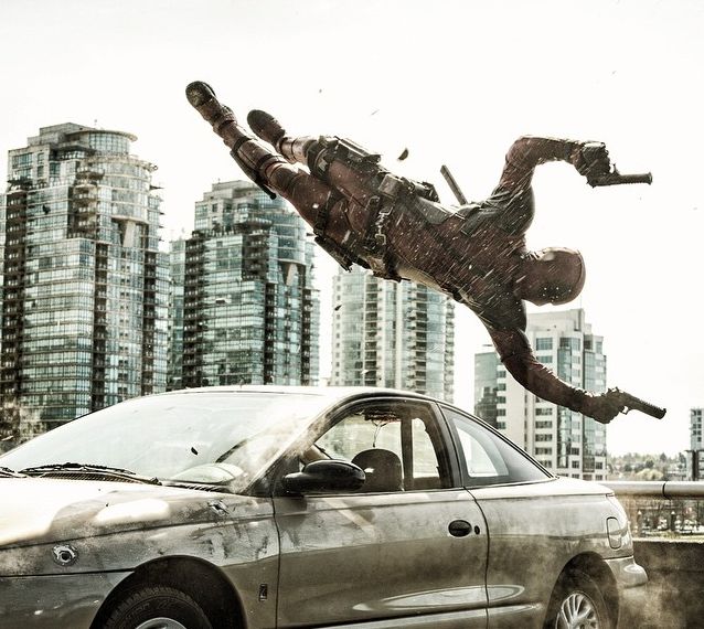 Ryan Reynolds flies around some bullets as Deadpool