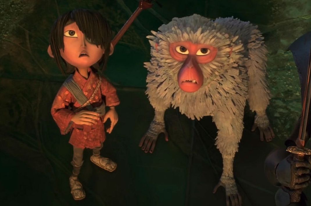 Kubo (Art Parkinson) and Monkey (Charlize Theron) in "Kubo and the Two Strings"