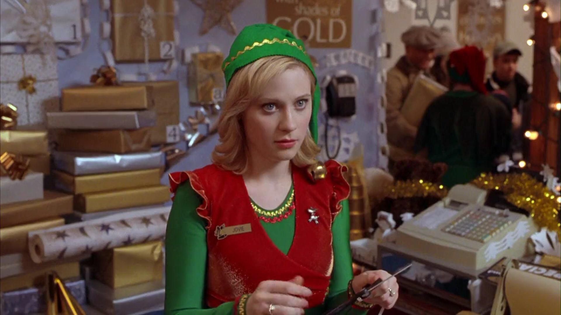 Not a North Pole elf, but an elf nonetheless and elf enough to catch Elf's eye and capture his heart. Zooey Deschanel pl