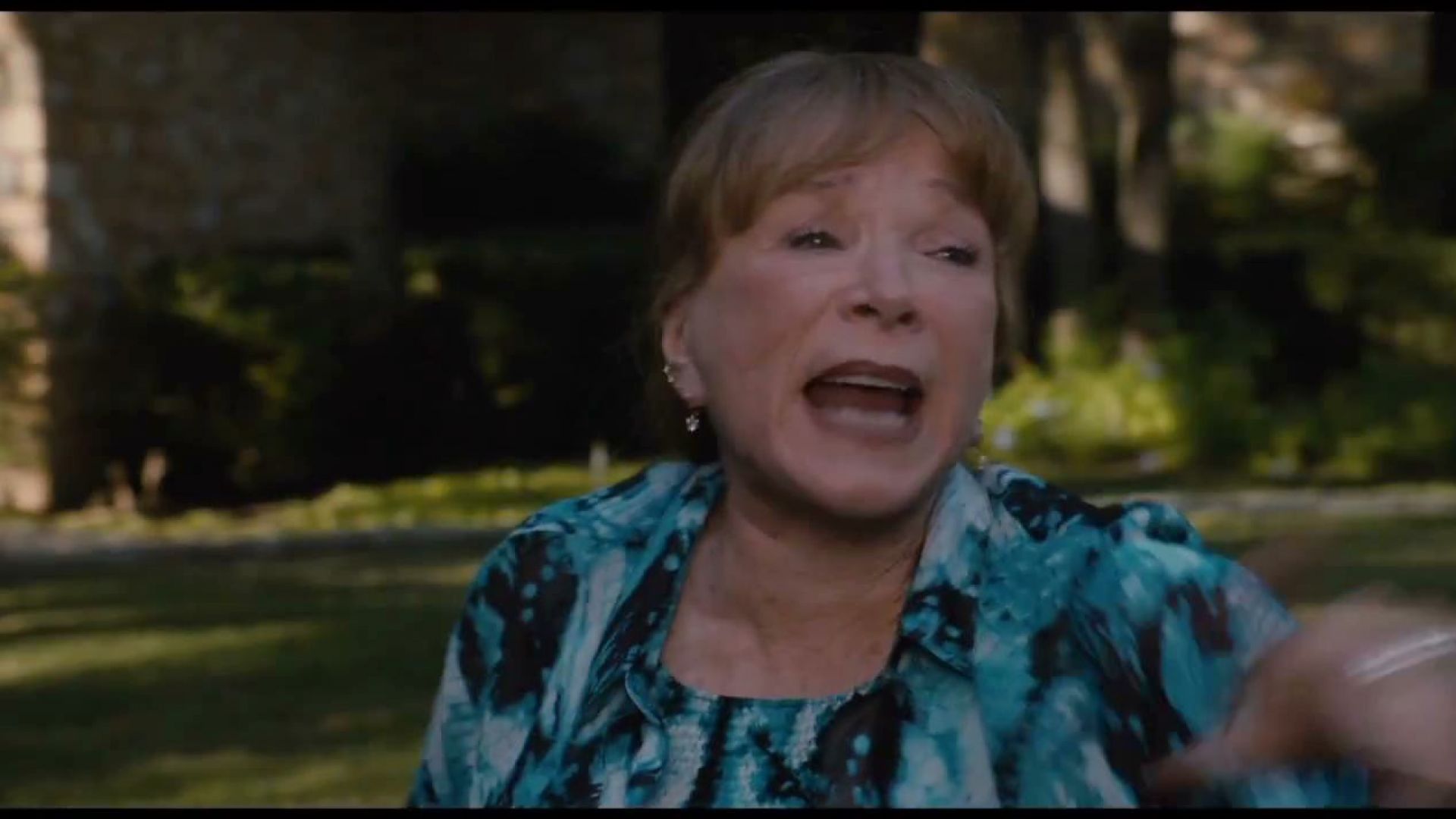 Jack Black tries to drive away, but Shirley MacLaine closes the gate in Bernie